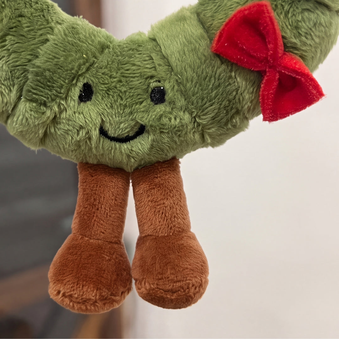 WreathBuddy – Peluche Colgante de Corona de Navidad con Lazo Rojo
